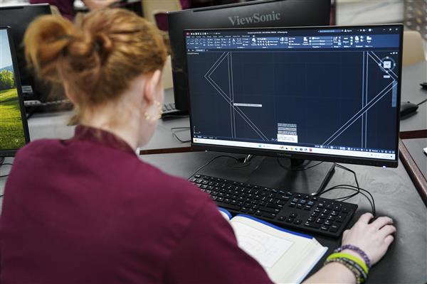 Architecture and Construction Engineering students working on computers 